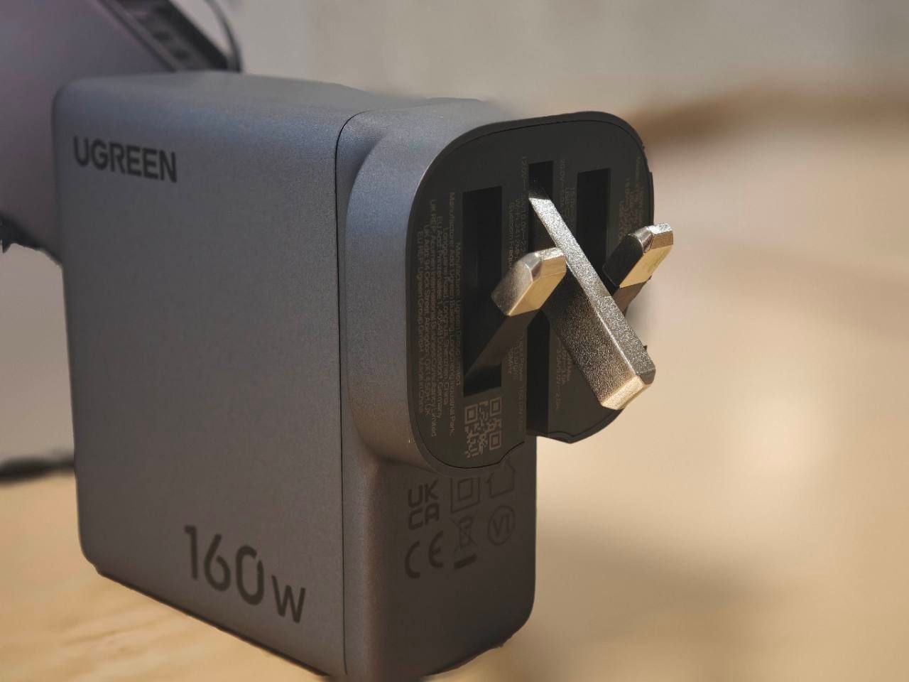 Close view of the UGREEN Nexode Pro charger's partially folded UK plug