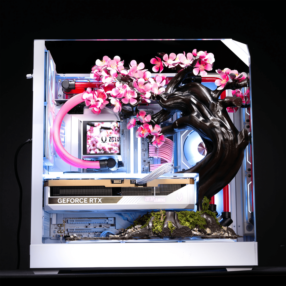 Side view of the AFTERSHOCK Cherry Bloom PC showing its custom liquid-cooling loop and internal components