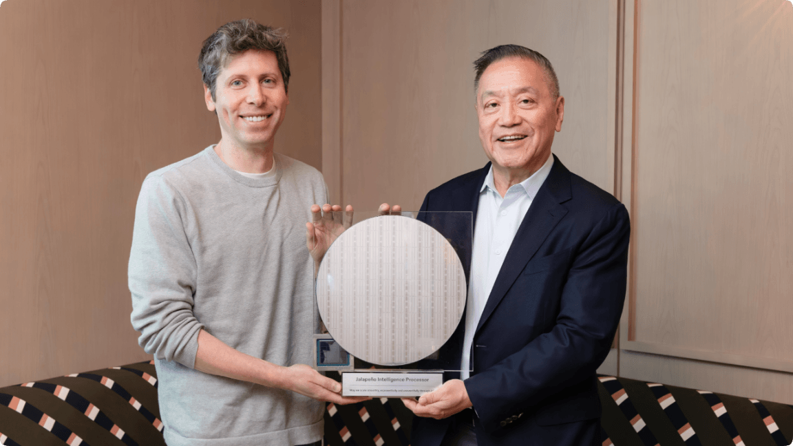 Sam Altman and Broadcom CEO Hock Tan holding a Jalapeño Intelligence Processor wafer display